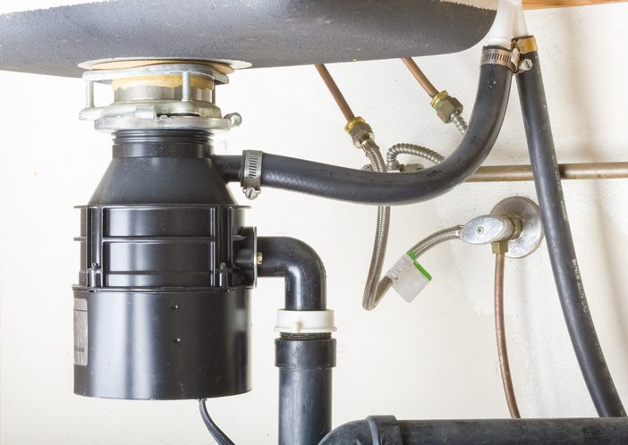 Under the sink. Garbage Disposal Repair